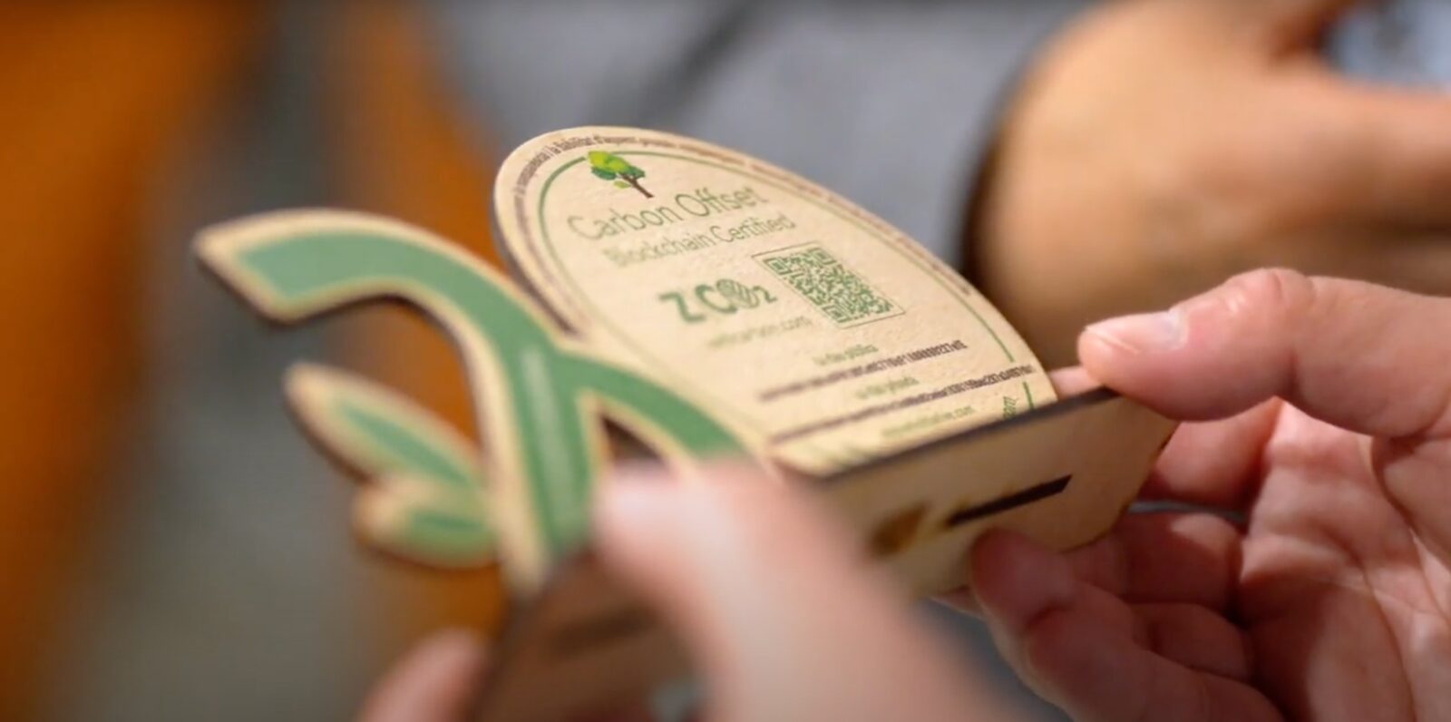 Physical wooden token badge with QR code